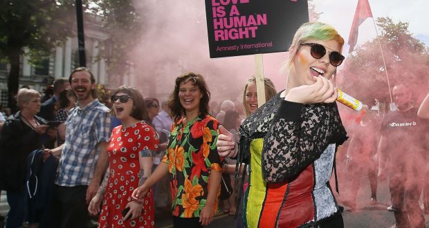 People take part in Belfast’s annual Pride parade. The extension of abortion and same-sex marriage rights to Northern Ireland has come a step closer after the House of Commons in London voted to introduce both by October 21st. Photograph: Brian Lawless/PA Wire