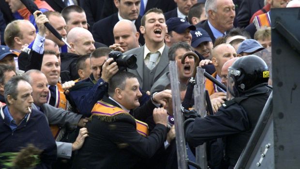 Police officers from the Police Service of Northern Ireland clash with Orangemen at the security barrier during a stand off at Drumcree, Portadown in 2002. Photograph: Paul McErlane/Reuters