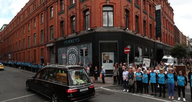 The funeral procession of founder Arthur Ryan passes the original Penneys store on Mary Street as staff form a guard of honour. Photograph: John Mc ElroyPhotograph: Brian Lawless/PA Wire 