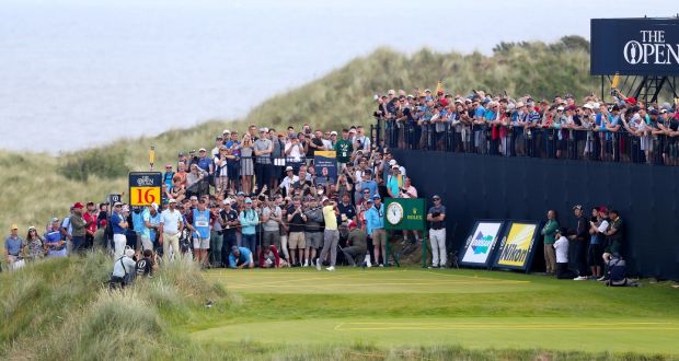 Crowds watch Tiger Woods tee off on the 16th during a practice round ahead of The Open Championship 2019 at Royal Portrush Golf Club. Photo: Niall Carson/PA Wire