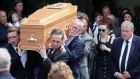 The remains of Karl Shiels are carried from church followed by his partner, Laura Honan.  Photograph: Colin Keegan/Collins