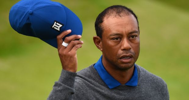 US golfer Tiger Woods reacts after finishing the 18th hole during the first round of the British Open. Photograph: Getty Images