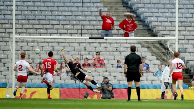 Tyrone’s goalkeeper Niall Morgan is unable to save a goal by James Loughrey. Photograph: James Crombie/Inpho
