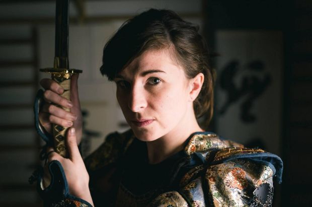 Bujinkan Namiryu Dojo member Alice Boland holding a samurai katana