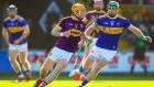 Wexford’s Kevin Foley in action against Tipperary’s Noel McGrath during the league. If Tipp can limit  Foley’s influence and keep his possessions under 10 to 12 they have a great chance. Photograph: Tommy Dickson/Inpho