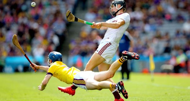  Wexford’s Dylan Whelan attempts to block Paddy Cummins of Galway. Photograph: Ryan Byrne/Inpho