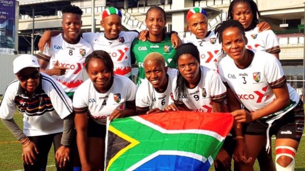 Members of South Africa Gaels GGA Club holding a South Africa Flag