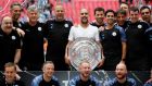  Manchester City manager Pep Guardiola celebrates with coaching staff as they pose with the trophy after winning the FA Community Shield at Wembley: Photograph: David Klein/Reuters
