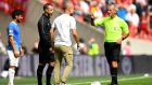 City manager Pep Guardiola is shown a yellow card by referee Martin Atkinson during the  Community Shield game  between Liverpool and Manchester City at Wembley Stadium. Photograph:  Clive Mason/Getty Images