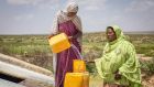 Sahra Mohamed and Marya Abdulah get drinking water from the Concern and Echo-funded water catchment tank in northern Somaliland. Photograph: Gavin Douglas/ Concern Worldwide
