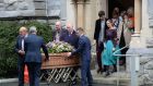  Ferdia Mac Anna,  husband of  the late Irish Times journalist  Kate Holmquist and members of her family accompany her coffin at her funeral service in St Pauls Church, Silchester Road, Glenageary. Photograph: Alan Betson/ The Irish Times