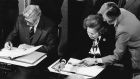Taoiseach Garret FtizGerald and  British prime minister Margaret Thatcher signing  the Anglo-Irish agreement. “We will have to work with the British and they with us to get out of the present unfortunate situation.” Photograph: Matt Kavanagh