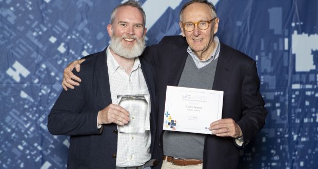 Dublin Airport spatial data manager Morgan Crumlish receiving the award from Jack Dangermond, co-founder and president  of Environmental Systems Research Institute (ESRI)