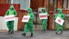 Irish-language protesters dressed in crocodile costumes. Photograph: Justin Kernoghan
