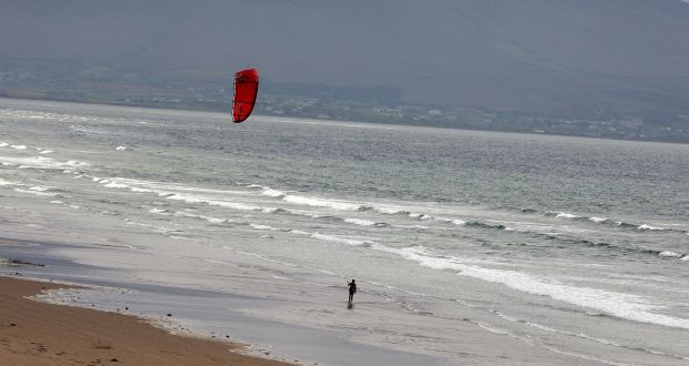  Kite surfing on Inch Beach, Co Kerry. There is no more productive exercise than a long run down a sandy beach – as Kerry footballers past and present can attest.   Photograph: Lorraine O’Sullivan/Inpho