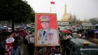 A man holds a portrait of Myanmar’s military commander-in-chief  Gen Min Aung Hlaing during a rally to denounce  US sanctions in Yangon earlier this month. Photograph: Lynn Bo Bo/EPA