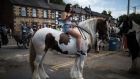  A woman checks her phone  on the opening day of the annual Appleby Horse Fair, in   north-west England. For today’s children and young teenagers, the smartphone is just something that has been around for as long as they have. Photograph: Oli Scarff/AFP/Getty  