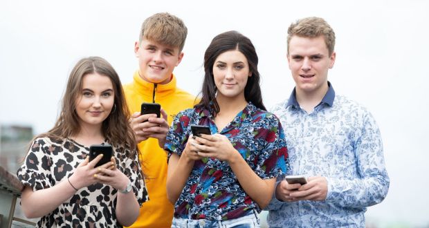 Young smartphone users Ciara Fanning, Sean Carey, Caoilfhinn Ní Choiligh and Gearoid O’Donovan. Parenting coach Allen O’Donoghue says children’s phone use is a ‘massive issue’ among parents he works with. Photograph: Tom Honan