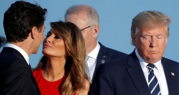 First lady Melania Trump kisses Canada’s prime minister Justin Trudeau next to the US president Donald Trump during the family photo  at the G7 summit in Biarritz, France on Sunday. Photograph: Carlos Barria/Reuters