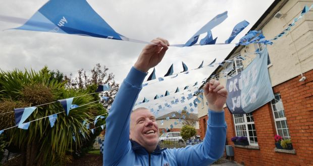 Brendan White who lives on Clonliffe Road puts up bunting in support of Dublin ahead of the  All-Ireland football final at Croke Park. Photograph: Alan Betson/The Irish Times