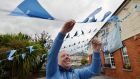 Brendan White who lives on Clonliffe Road puts up bunting in support of Dublin ahead of the  All-Ireland football final at Croke Park. Photograph: Alan Betson/The Irish Times
