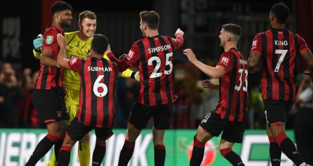 Bournemouth’s Irish goalkeeper Mark Travers  celebrates with team-mates after winning the penalty shoot-out during the Carabao Cup second-round match against  Forest Green Rovers at the Vitality Stadium. Photograph: Mike Hewitt/Getty Images