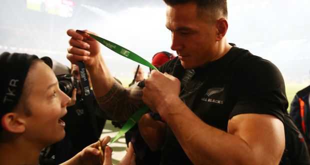 Sonny Bill Williams of New Zealand gives his winning medal to young fan Charlie Lines following the 2015 Rugby World Cup final. Photograph: Paul Gilham/Getty