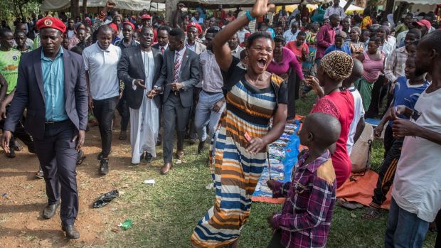 Bobi Wine (centre) leaves a campaign event in Gombe, Uganda. Photograph: Sally Hayden.