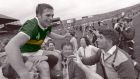 Kerry’s Páidí Ó Sé is held aloft by supporters after Kerry’s victory over Dublin in the 1985 All-Ireland Football final. Ready to greed him is Kerry manager Mick O’Dwyer. Photograph: Ray McManus/Sportsfile 