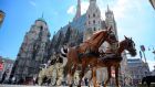 A carriage passes by the St Stephen’s cathedral in Vienna, Austria. Photograph: Joe Klamar/AFP/Getty