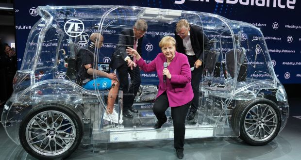 Angela Merkel tours the Frankfurt motor show on Thursday. Photograph: Getty
