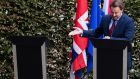 Invisible man: Boris Johnson fails to join Luxembourg prime minister Xavier Bettel for a joint press conference. Bettel gestures to an empty podium. Photograph: Joshua Sammer/Getty 