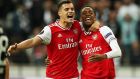 Joe Willock  celebrates with Granit Xhaka after he scored Arsenal’s opening goal in the Europa League Group F match against  Eintracht Frankfurt at the Commerzbank arena. Photograph: Christian Kaspar-Bartke/Bongarts/Getty Images
