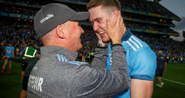 Dublin’s Brian Fenton celebrating with manager Jim Gavin after the All–Ireland final replay in Croke Park. Photograph: Oisin Keniry/Inpho 