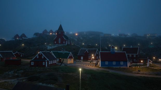Fog from the sea covers Sisimiut, the site of this year’s Greenlandic soccer championship. Photograph: Kieran Dodds/New York Times