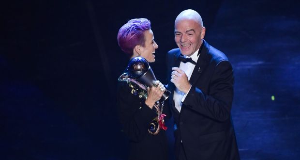 Megan Rapinoe is presented with her Fifa women’s player of the year award from Fifa president Gianni Infantino at La Scala opera house in Milan. Photograph: Marco Bertorello/AFP/Getty Images