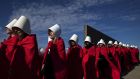  Activists in Argentina  disguised as characters from The Handmaid’s Tale.  In hellish, dystopian Gilead, handmaids are given the names of their captors as a way of obliterating their dignity. Photograph:  Alejandro Pagni/AFP/Getty Images