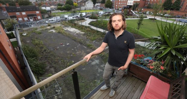 Patrick Fenton on the balcony of his apartment in the Southgate development on Cork Street in Dublin 8 overlooking the proposed site. Photograph: Nick Bradshaw