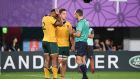 Referee Romain Poite speaks to Australia’s flanker Michael Hooper and centre Samu Kerevi during the Rugby World Cup clash against Wales. Photo: William West/Getty Images