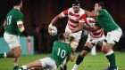 Japan lock Luke Thompson is tackled by Johnny Sexton and CJ Stander during the Rugby World Cup Pool A game at the Ecopa stadium in  Shizuoka. Photograph:   Anne-Christine Poujoulat/AFP/Getty Images