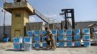   A sniffer dog checks election ballot boxes for explosives after they were unloaded from a truck at a warehouse in Kabul on Sunday.  Photograph: Getty Images