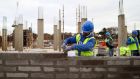 A construction worker lays a row of bricks on a Cairn Homes construction site in Dublin. Irish Institutional Property, a lobby group of which Cairn is a member, wants the Help to Buy scheme to be extended and expanded in scope in Budget 2020. Photograph: Chris Ratcliffe/Bloomberg