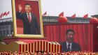 Participants cheer beneath a large portrait of Chinese president Xi Jinping during a parade to commemorate the 70th anniversary of the founding of Communist China in Beijing on Tuesday. Photograph: Mark Schiefelbein/AP