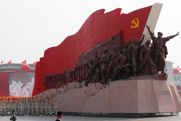 A float featuring Communist heroic figures moves past Tiananmen Square. Photograph: EPA/Wu Hong