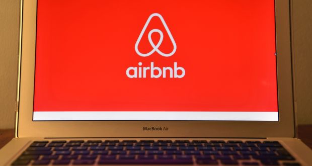 The Airbnb logo is displayed on a computer screen.  Photograph: Carl Court/Getty Images