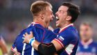 Russia captain Vasily Artemyev (right) celebreates with team-mate  Kirill Golosnitskiy after the winger scored his side’s first try in the  Rugby World Cup  Group A game against  hosts Japan  at the Tokyo Stadium in the opening game of the competition. Photograph: Cameron Spencer/Getty Images