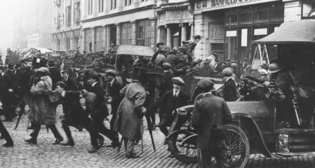 A convoy of Black and Tans and British soldiers arrives at the junction of Middle Abbey Street and O’Connell Street, Dublin, in 1921, during the War of Independence. Photograph: Sean Sexton/Getty Images
