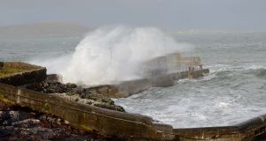 High seas smash into Roonagh Pier, Mayo, driven by high winds as Storm Lorenzo approaches. Photograph: Paul Mealey