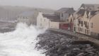 Waves crash agains the sea wall in Lahinch, Co Clare as thousands of homes and businesses were left without power as Storm Lorenzo passed across Ireland. Photograph: Brian Lawless/PA Wire