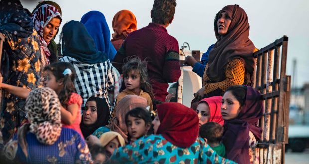 Civilians flee amid Turkish bombardment of Syria’s northeastern town of Ras al-Ayn along the Turkish border on Wednesday. Photograph:  Delil Souleiman/AFP via Getty Images